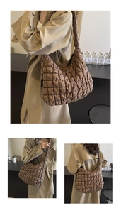 Detailed views of a brown quilted bubble puffer bag worn with a stylish trench coat