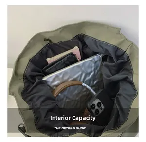 Internal view of olive green nylon tote bag showing spacious capacity and magnetic closure