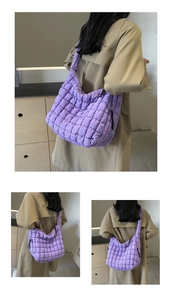 Detail of purple quilted bubble bag showing padded nylon texture and large storage space