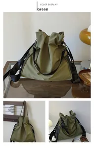 Detail view of military green nylon drawstring shoulder bag with black leather straps