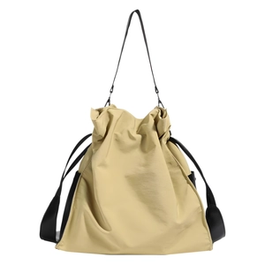 Minimalist beige nylon tote bag with drawstring closure and black shoulder straps