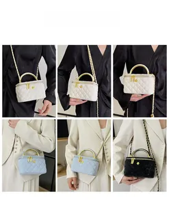Three elegant quilted chain vanity bags in white, light blue and black shown with models