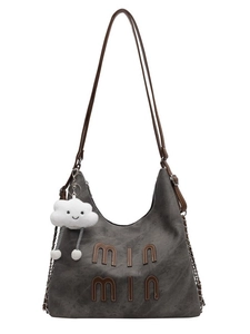 Retro gray frosted tote bag with brown leather handles and a plush cloud charm accessory