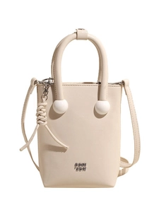 Creamy white mini bucket tote bag with circular handles and elegant braided pendant