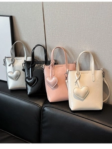 Mini bohemian woven tote bags in shiny lacquer finish with heart charms in multiple colors