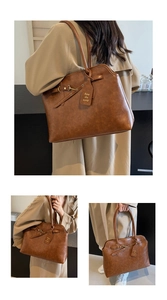 Close-up of vintage brown tote bag featuring metallic logo tag and belt buckle details