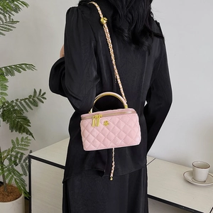 Pink quilted crossbody box bag with golden handle and chain strap for women