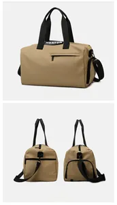 Detail view of khaki fitness bag featuring waterproof nylon fabric and durable zippers