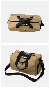 Macro view of khaki travel bag showing side zipper pocket and adjustable black strap