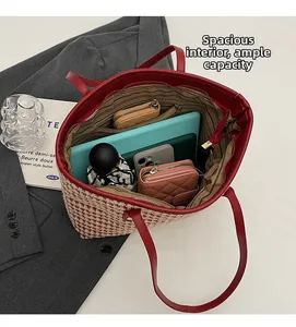 Macro shot of large red tweed tote bag interior showing ample storage for gadgets