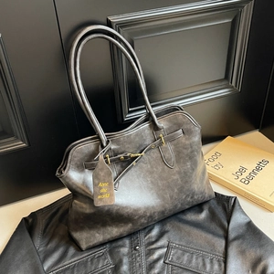 Vintage large capacity grey tote bag with buckle detail on minimalist dark background