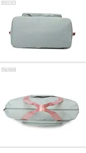 Top and bottom details of a large mint green travel bag with pink handles