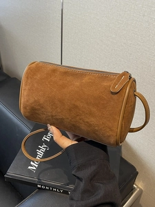 Caramel suede pillow shoulder bag with smooth leather trim and metal zip closure