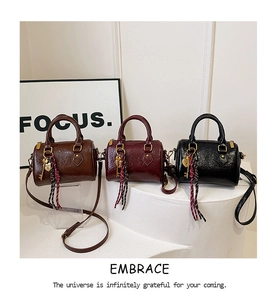 Three glossy wrinkled leather mini Boston bags in dark brown, burgundy, and black