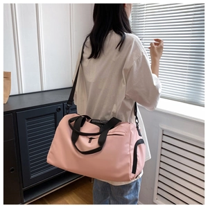 Close-up of pink fitness bag with dry wet separation and adjustable shoulder strap