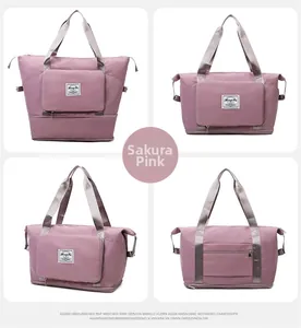 Detail view of pink oxford travel bag showing front, side, back and expandable base
