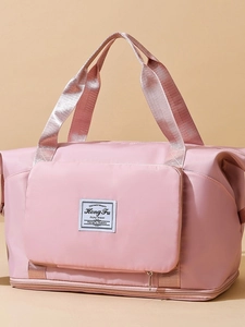 Pink oxford travel bag with large capacity and separate shoe compartment at bottom