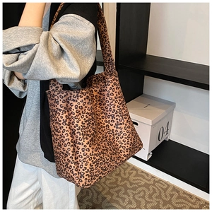 Leopard print canvas tote bag side view showing large capacity and soft fabric texture