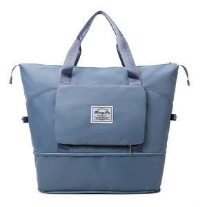 Grote Oxford reistas in Morandi blauw met ritsvak aan de voorkant en stevige handvaten