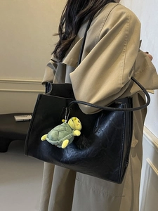 Classic black vintage faux leather tote bag for women with green turtle pendant