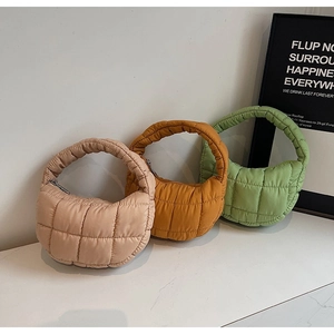 Minimalist quilted cloud bags in pastel colors featuring a stylish puffy crescent design