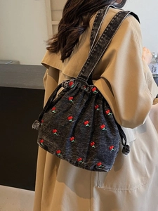 Denim drawstring bucket bag with red cherry embroidery and dual shoulder straps