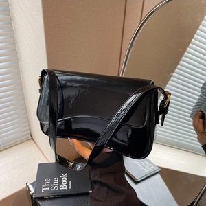 Elegant black glossy shoulder bag for women featuring a sleek flap and magnetic buckle