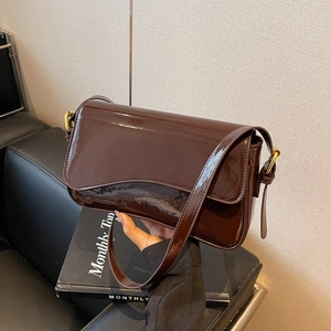 Minimalist dark coffee patent leather shoulder bag with gold buckle and flap design