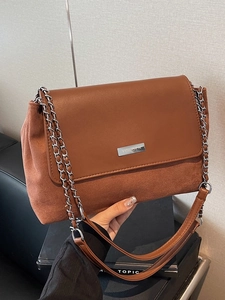 Retro brown suede underarm bag with smooth leather flap and silver chain shoulder strap