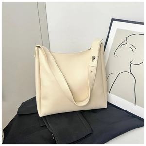 Detail of cream white minimalist hobo bag with smooth matte texture and wide shoulder strap