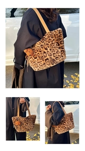 Detail of leopard print faux fur tote bag featuring brown leather straps and bear charm