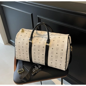 Close-up of stylish teddy bear print travel bag with golden bear zipper and nylon strap