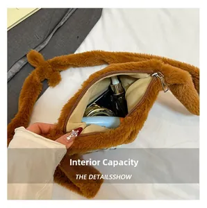 Detail showing the large interior capacity of this brown plush shoulder bag