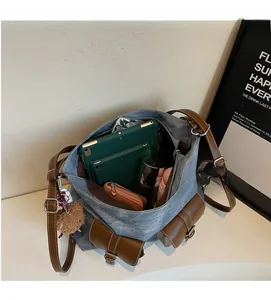 Macro view of large canvas tote bag showing spacious interior with multiple pockets
