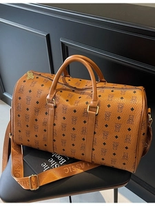 Classic brown boston travel bag with bear monogram pattern and wide classic strap