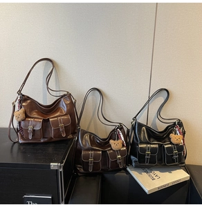 Three vintage leather tote bags with multi-pockets, bronze buckles, and scarf charms
