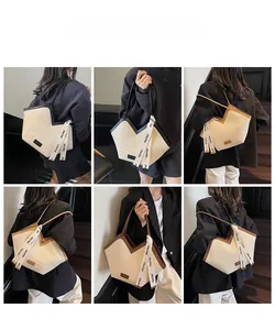 Multiple viste di una borsa tote in paglia intrecciata con scollo a V e nastro elegante