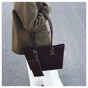 Deep purple leopard print suede tote bag with leather strap and matching small zipper pouch