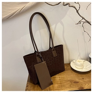 Detailed view of brown leopard print suede tote bag set with matching small pouch