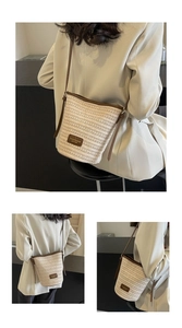 Close-up of woven straw bucket bag showing refined texture and brown leather strap details