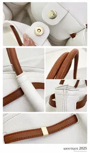 Nahaufnahme der weißen Handtasche aus Narbenleder mit braunem Riemen und Magnetverschluss