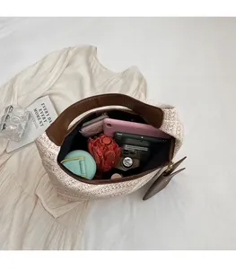 Detailed top view of the spacious straw tote bag interior showing its high capacity