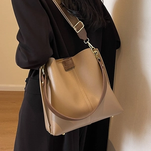 Fashionable khaki leather bucket bag with wide shoulder strap for women everyday style