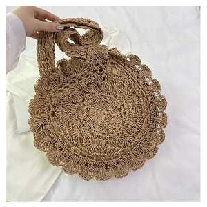 Fashionable hollow straw woven handbag for women with floral crochet pattern in beige