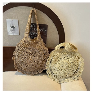 Handmade woven straw tote bags with hollow out floral patterns and scalloped edges for beach
