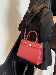 Elegant red leather wedding tote bag with gold hardware and shoulder strap for women