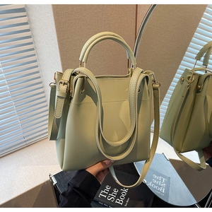 Detailed view of mint green bucket bag featuring premium PU texture and gold hardware details