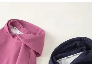 Detail of hood neckline and embroidery on cotton blend hoodies for children