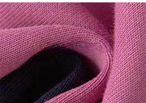 Detailed macro view of soft ribbed knit fabric texture in purple and navy blue