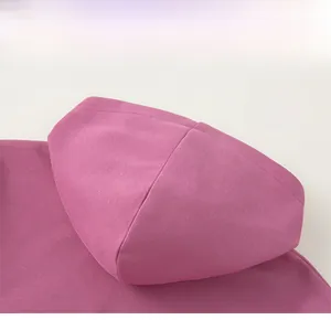 Detailed close-up of premium rose purple hooded sweatshirt featuring soft cotton knit fabric